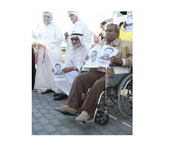 AbdulJalil Alsingace (r) protesting against arbitrary detention