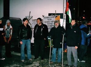 From the right, Aaron with Brian Haw and others at the 24/7 vigil outside the Israeli Embassy in London, during Operation Cast Lead.